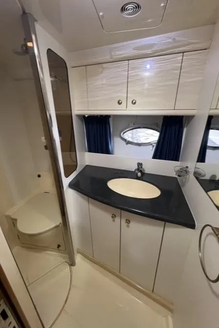 Slide: The Image of Luxurious bathroom interior of 1994 Sunseeker Camargue 55 yacht with modern amenities. - 14