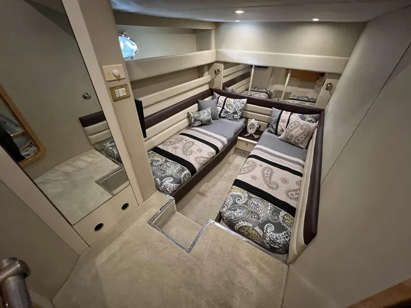 Slide: The Image of Luxurious interior of 1994 Sunseeker Camargue 55 yacht with twin beds and elegant decor. - 19