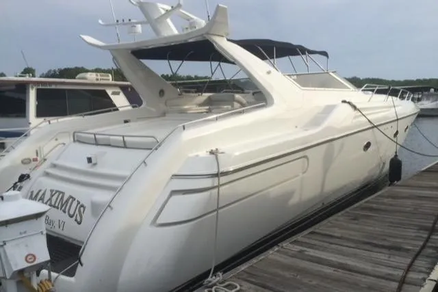 Slide: The Image of 1994 Sunseeker Camargue 55 yacht docked at a marina. - 6