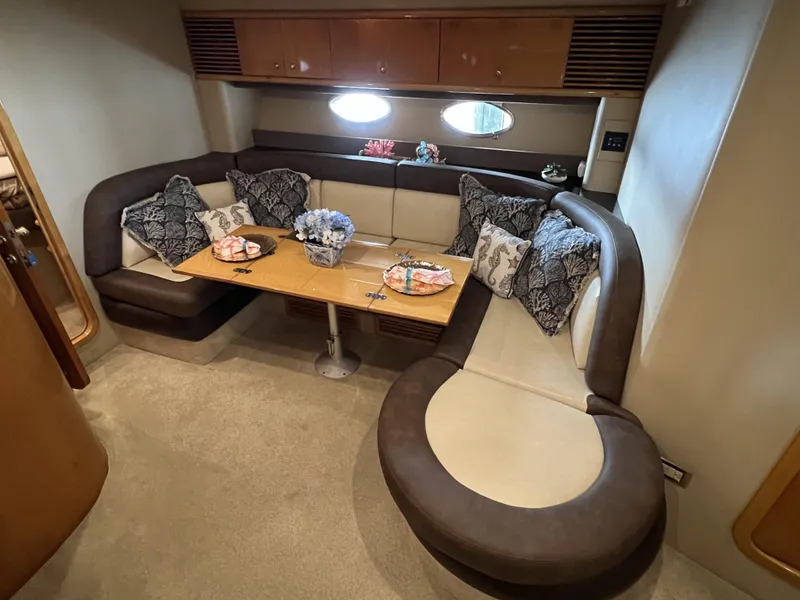Slide: The Image of Luxurious interior of 1994 Sunseeker Camargue 55 yacht with elegant seating and table. - 9
