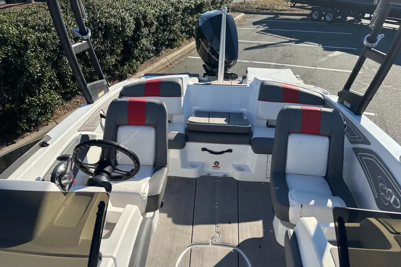Slide: The Image of 2024 Tahoe T21 boat interior with seating and steering wheel. - 10