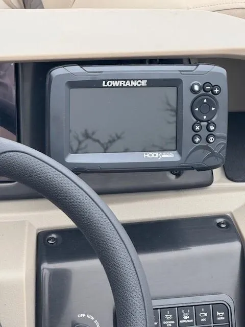 Slide: The Image of Lowrance fish finder on 2025 Sun Tracker SportFish 22 DLX dashboard. - 3
