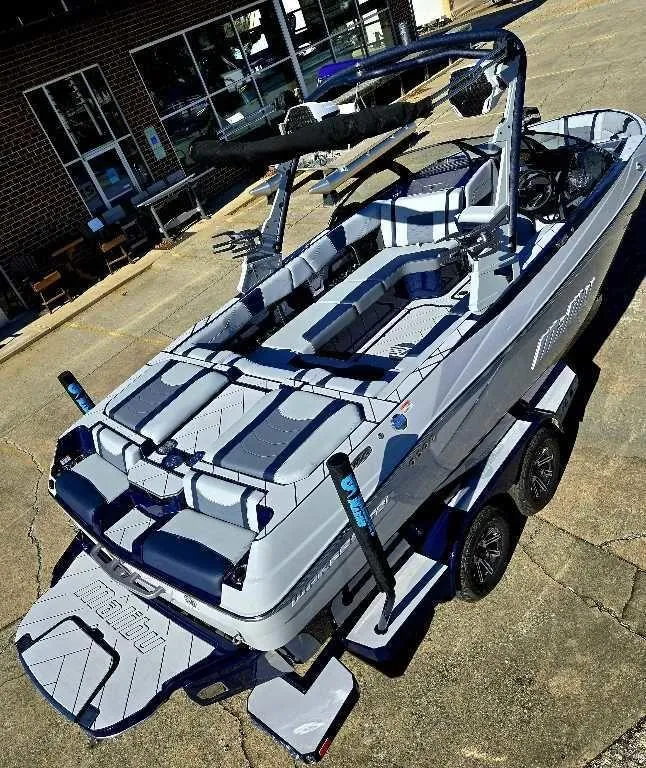 Slide: The Image of 2025 Malibu Wakesetter 23 LSV boat on trailer, showcasing sleek design and modern features. - 5