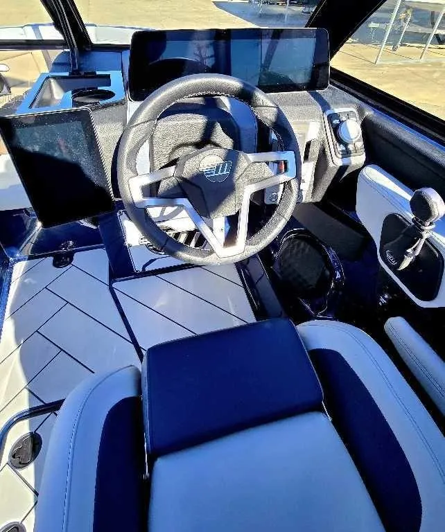 Slide: The Image of 2025 Malibu Wakesetter 23 LSV cockpit with modern steering and controls. - 6