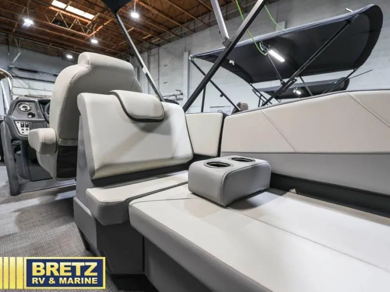 Slide: The Image of 2025 Mirage LZ A-22 SPORT boat interior with plush seating and cup holders. - 16