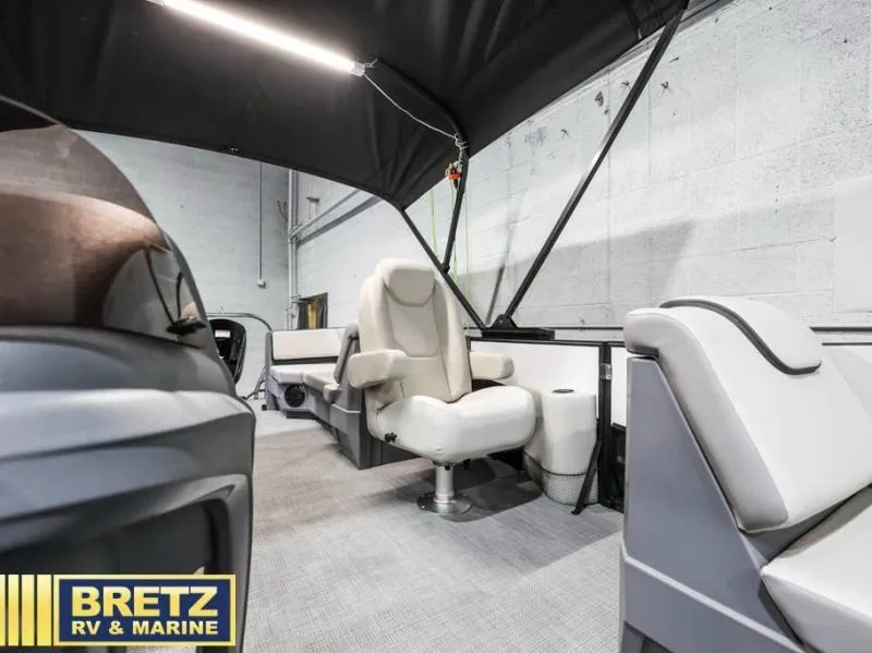 Slide: The Image of Interior of 2025 Mirage LZ A-22 SPORT boat with plush seating and canopy. - 19