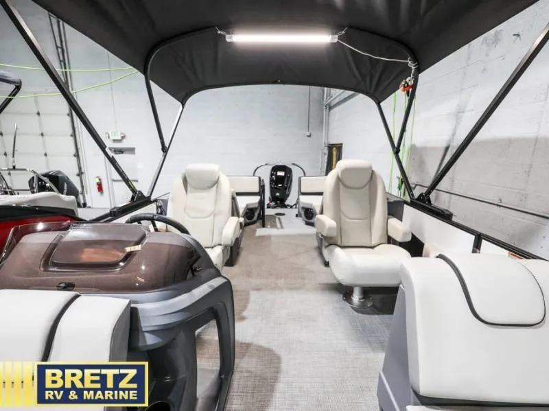 Slide: The Image of Interior of 2025 Mirage LZ A-22 SPORT boat with seating and canopy. - 21