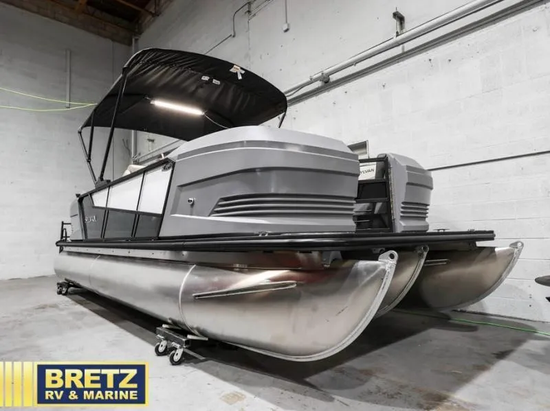 Slide: The Image of 2025 Mirage LZ A-22 SPORT pontoon boat in showroom, featuring sleek design and modern amenities. - 4