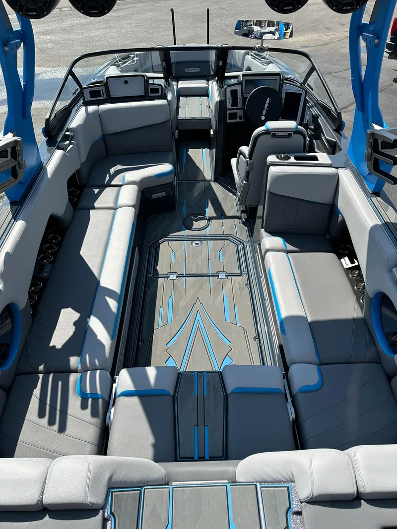 Slide: The Image of 2022 Supra SE boat interior with modern seating and sleek design. - 11