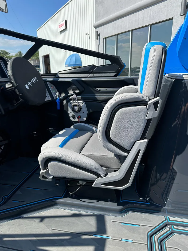Slide: The Image of 2022 Supra SE interior with modern gray and blue seating, showcasing sleek design and comfort. - 20