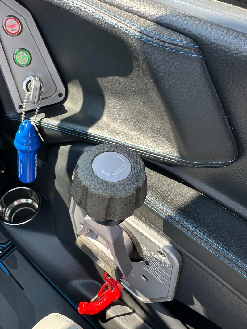 Slide: The Image of Interior of a 2022 Supra SE boat featuring control panel and ignition keys. - 24