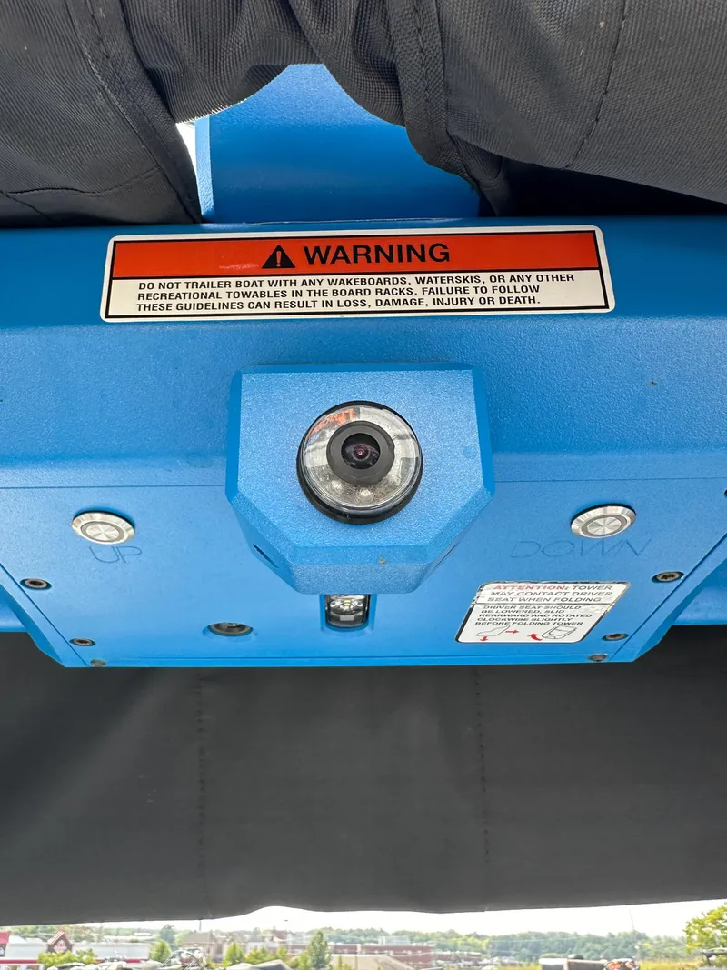 Slide: The Image of 2022 Supra SE boat warning label and camera system in blue casing. - 26
