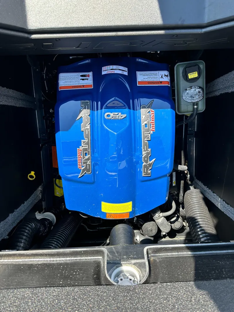 Slide: The Image of 2022 Supra SE engine compartment with blue Raptor motor. - 28