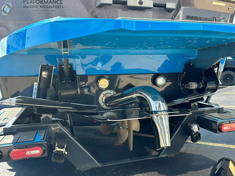 Slide: The Image of 2022 Supra SE boat rear view with propeller and exhaust system. - 4