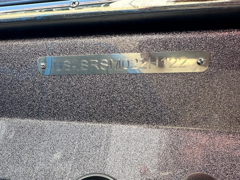 Slide: The Image of 2022 Supra SE boat identification plate with serial number on metallic surface. - 8