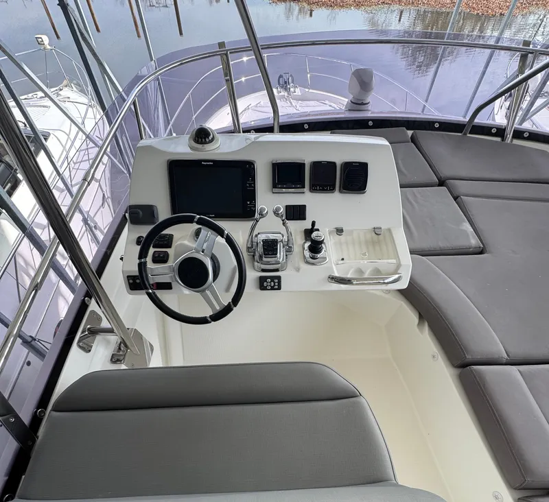 Slide: The Image of Helm station of a 2016 Prestige 550 yacht. - 13