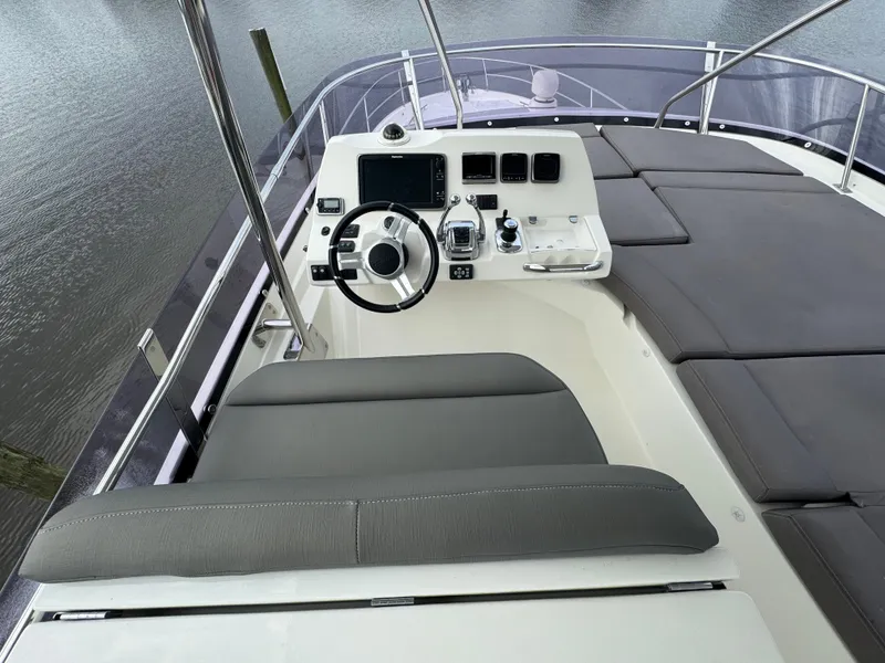 Slide: The Image of Helm station of a 2016 Prestige 550 yacht. - 14