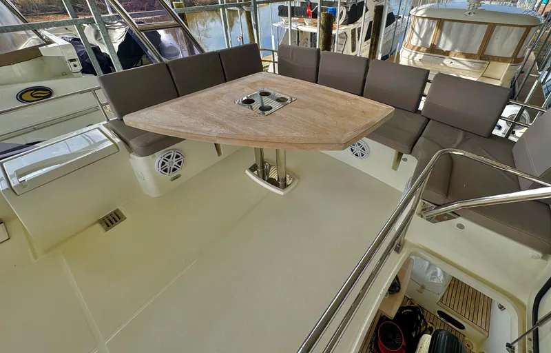 Slide: The Image of Interior of a 2016 Prestige 550 yacht with seating area and table. - 18