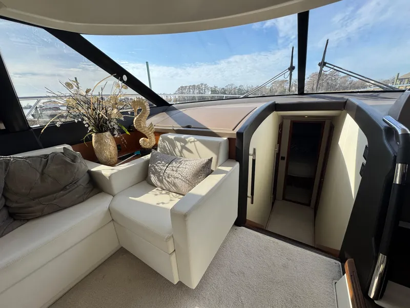 Slide: The Image of Interior of a 2016 Prestige 550 yacht with luxurious seating area. - 22