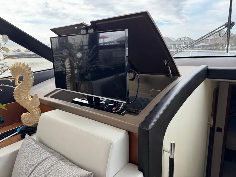 Slide: The Image of Interior of a Prestige 550 yacht with TV and decor. - 26