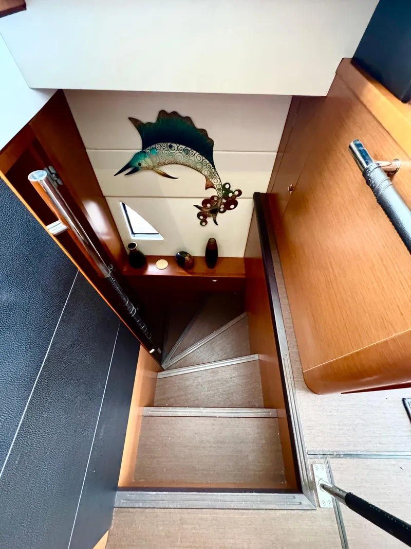 Slide: The Image of Interior of a 2016 Prestige 550 yacht, staircase with fish decor. - 29