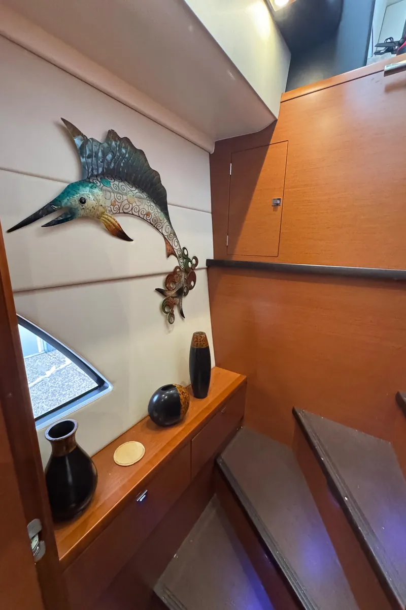 Slide: The Image of Interior of a 2016 Prestige 550 yacht, staircase with decorations. - 30