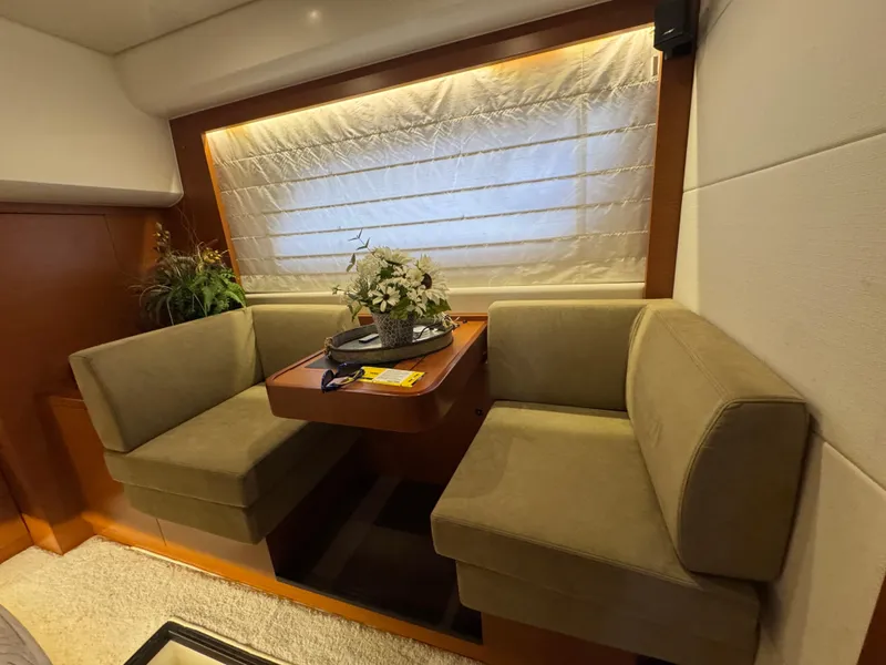 Slide: The Image of Interior of a 2016 Prestige 550 yacht with cozy seating area. - 37
