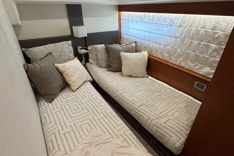 Slide: The Image of Interior of a 2016 Prestige 550 yacht with twin beds. - 42