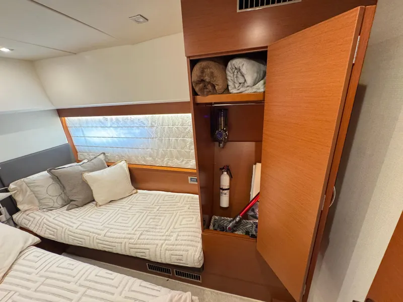 Slide: The Image of Interior of a 2016 Prestige 550 yacht with bed and storage. - 44