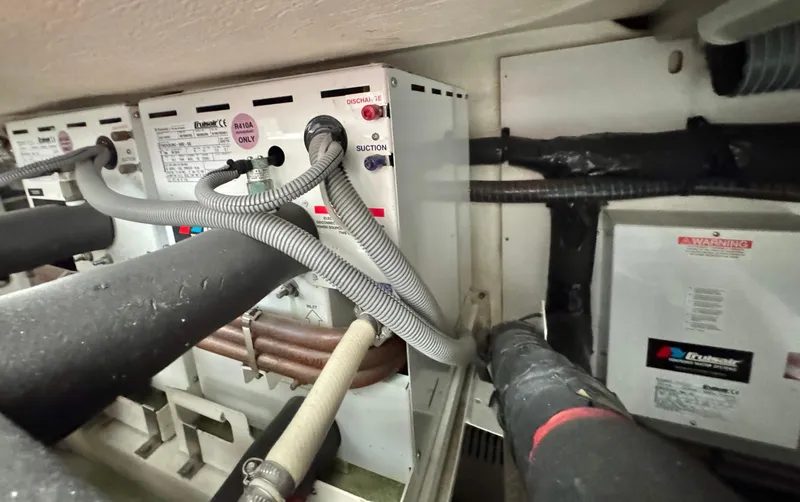 Slide: The Image of Engine room of a 2016 Prestige 550 with hoses and cables. - 47