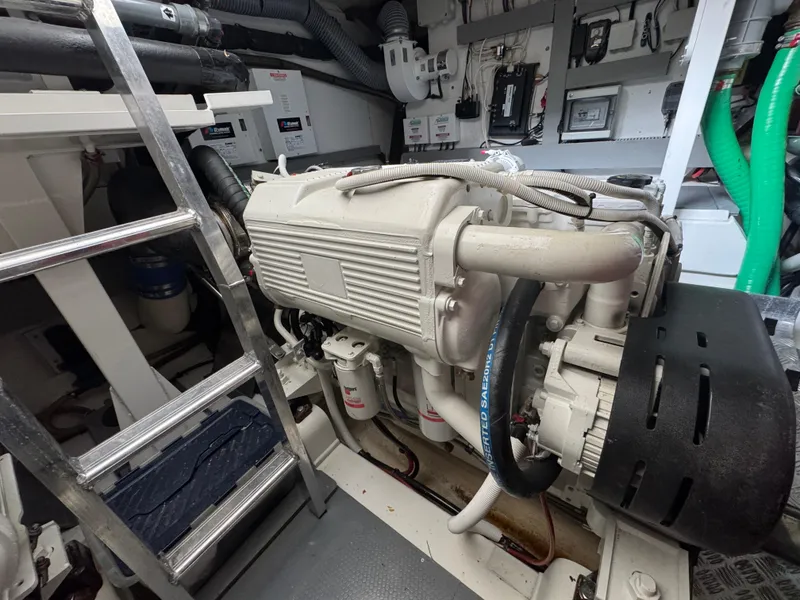 Slide: The Image of Engine room of a 2016 Prestige 550 yacht with ladder and hoses. - 49