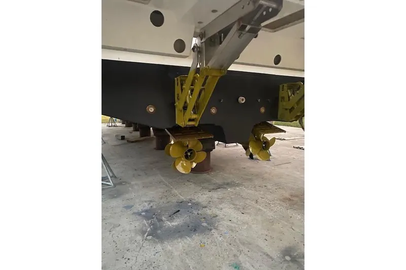 Slide: The Image of 2016 Prestige 550 yacht propellers and hull in maintenance area. - 59