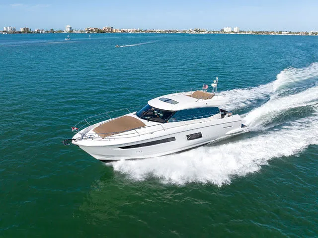 Slide: The Image of 2016 Prestige 550 boat on trailer at night. - 64