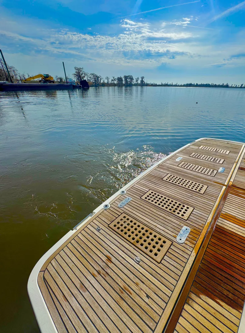 Slide: The Image of 2016 Prestige 550 yacht on calm waters under a sunny sky. - 8