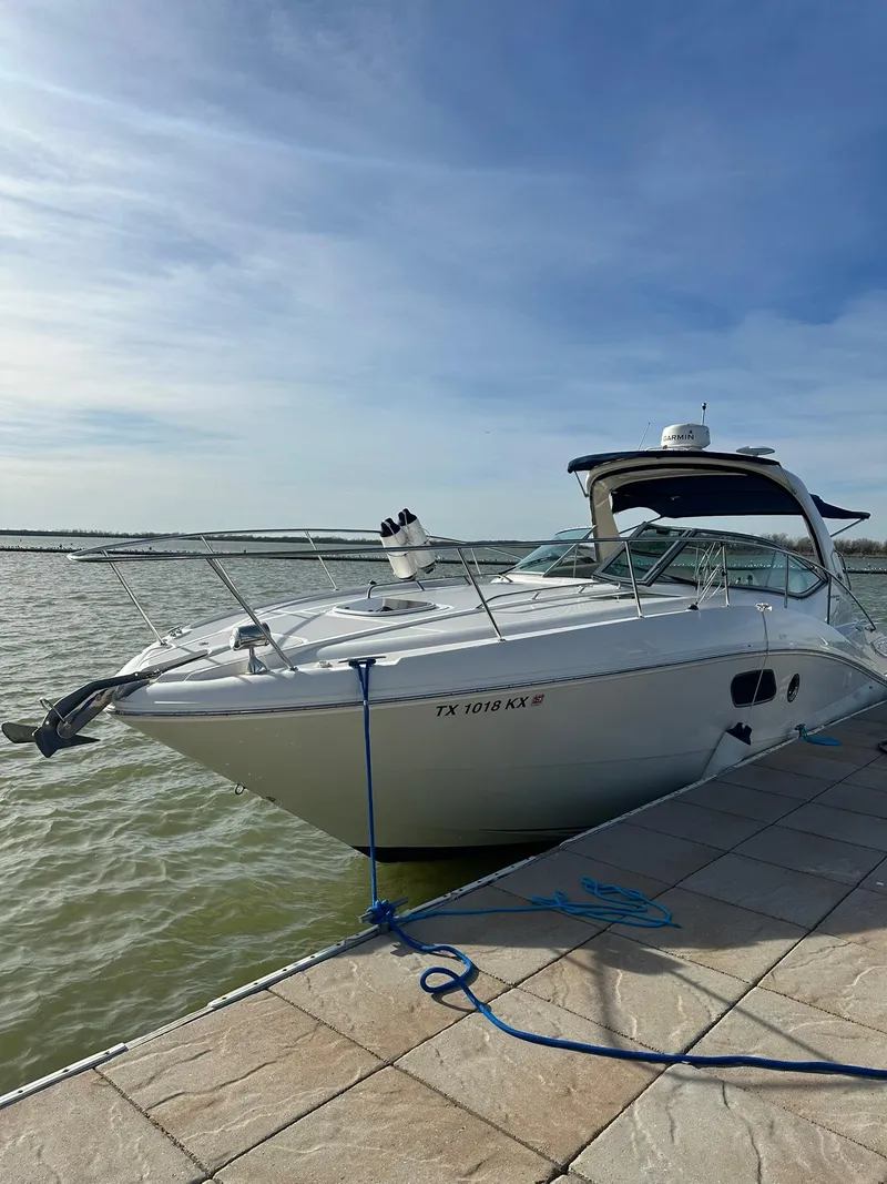 Slide: The Image of 2011 Sea Ray 350 Sundancer docked by the water on a sunny day. - 18