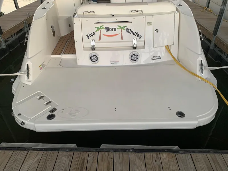 Slide: The Image of Luxurious interior of 2011 Sea Ray 350 Sundancer yacht with cozy bed and elegant wood finish. - 2