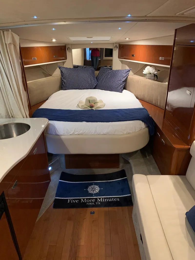 Slide: The Image of Luxurious interior of 2011 Sea Ray 350 Sundancer yacht with cozy bed and elegant decor. - 20