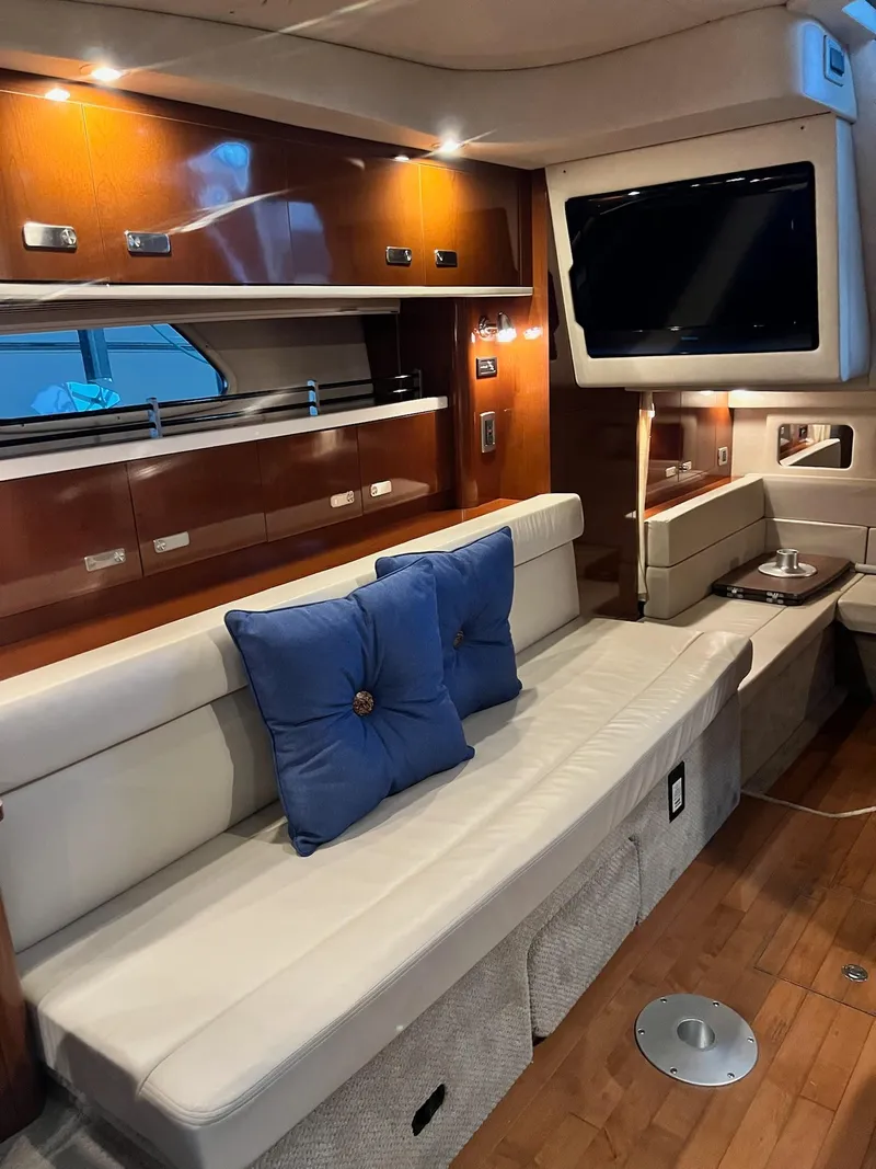 Slide: The Image of Luxurious interior of 2011 Sea Ray 350 Sundancer yacht with plush seating and modern amenities. - 26