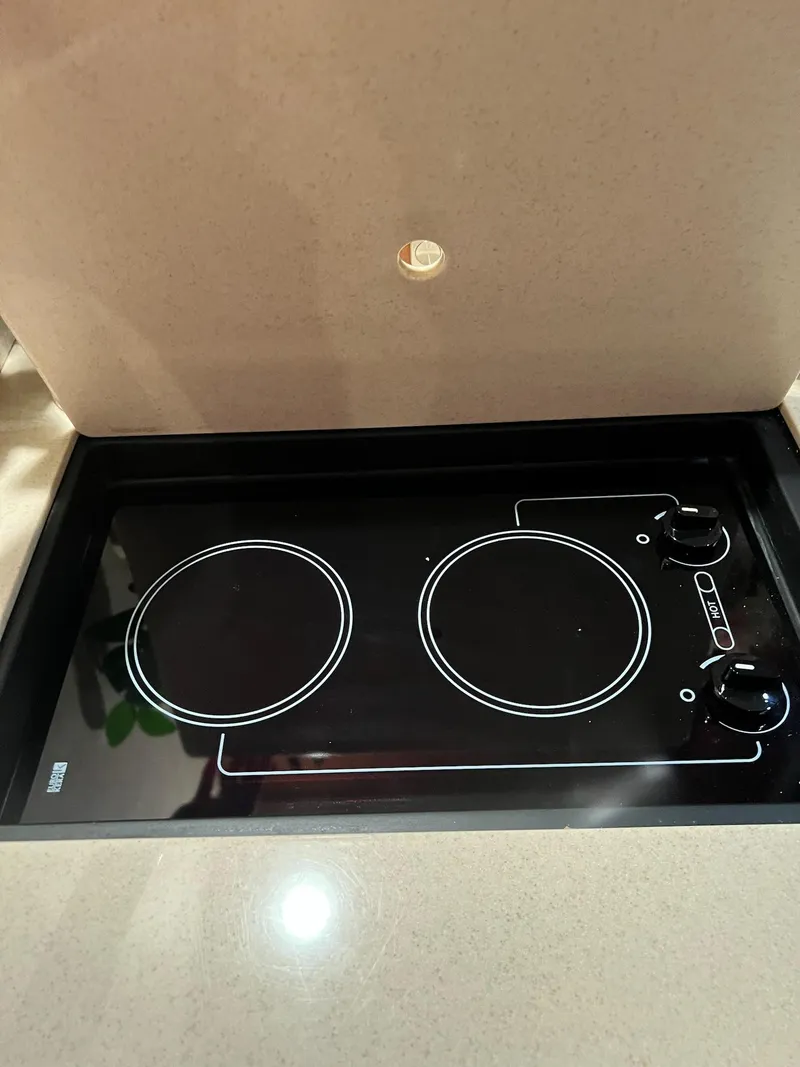 Slide: The Image of Stovetop in 2011 Sea Ray 350 Sundancer yacht kitchen area. - 33