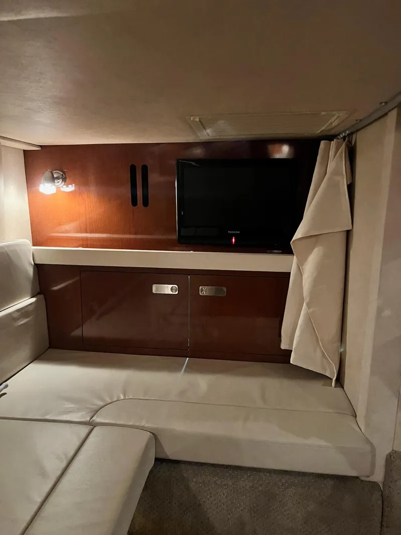 Slide: The Image of Interior cabin of 2011 Sea Ray 350 Sundancer with TV and seating area. - 37