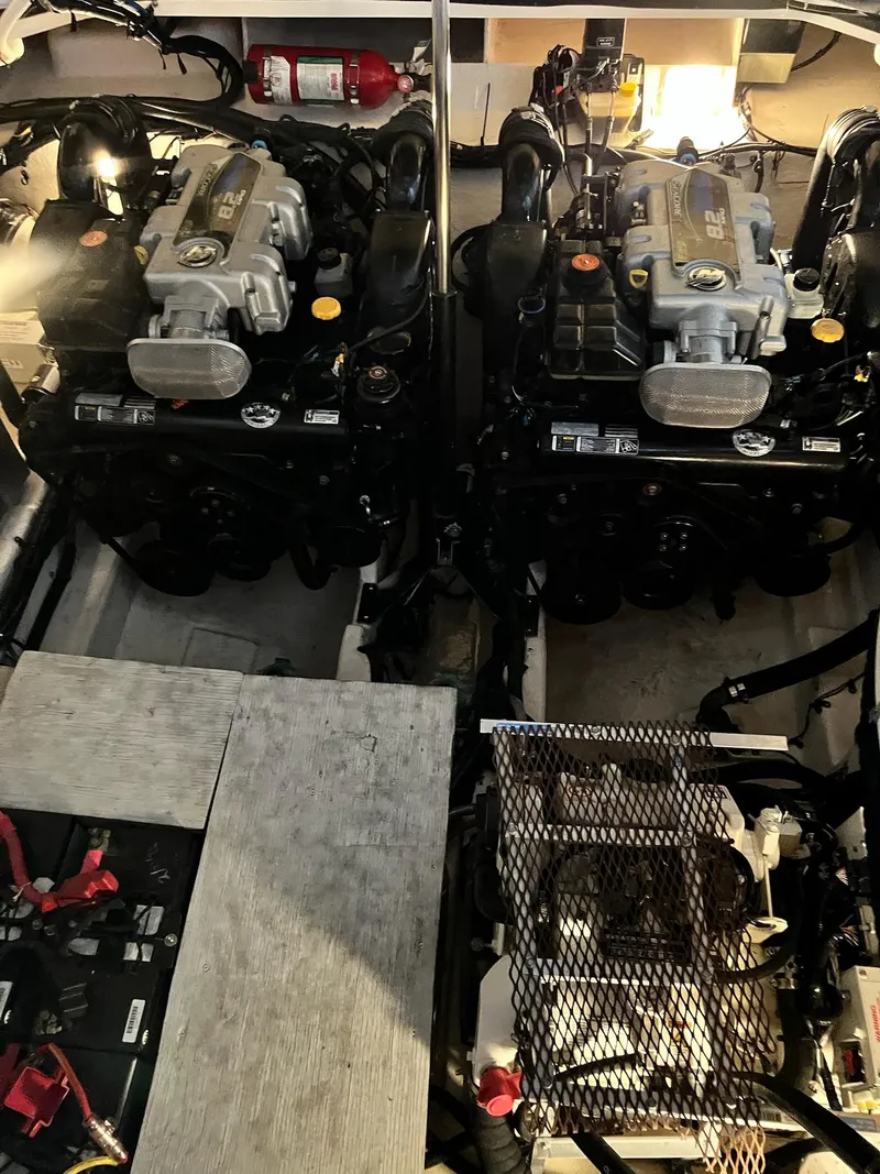 Slide: The Image of Engine room of 2011 Sea Ray 350 Sundancer with dual engines and equipment. - 45