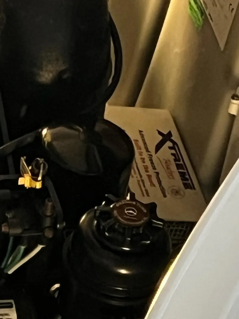 Slide: The Image of Engine compartment of a 2011 Sea Ray 350 Sundancer with visible components and Xtreme heater. - 48