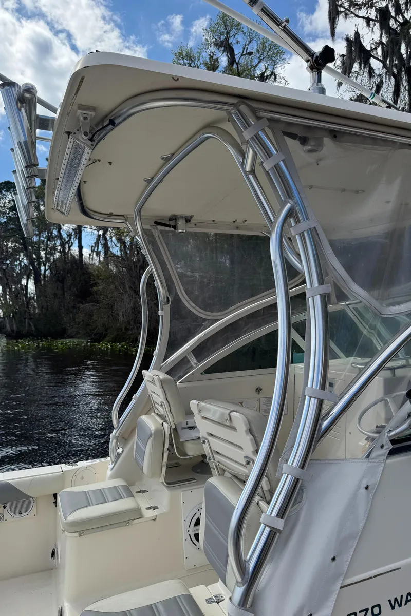Slide: The Image of 1999 Pursuit 2870 Walkaround boat with sleek design and sturdy metal framework. - 19