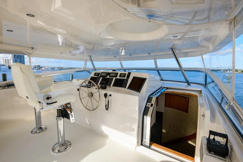 Slide: The Image of 2009 Pacific Mariner 85 yacht helm with modern controls and panoramic ocean view. - 12