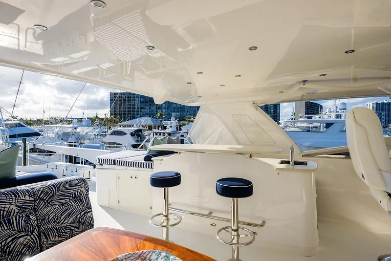 Slide: The Image of Luxurious 2009 Pacific Mariner 85 yacht interior with bar stools and marina view. - 17