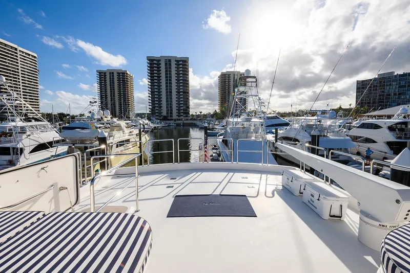 Slide: The Image of 2009 Pacific Mariner 85 yacht docked in a marina with city skyline. - 18
