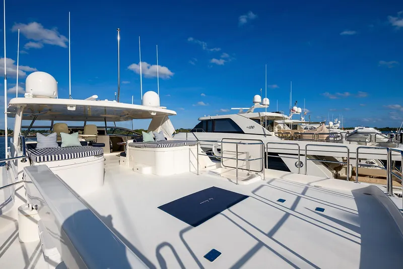 Slide: The Image of Luxury 2009 Pacific Mariner 85 yacht docked under clear blue skies. - 19