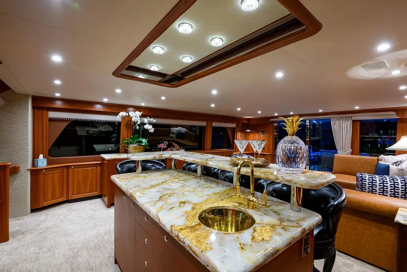 Slide: The Image of Luxurious interior of 2009 Pacific Mariner 85 yacht with elegant marble countertop and plush seating. - 26