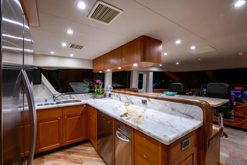 Slide: The Image of Luxurious kitchen interior of 2009 Pacific Mariner 85 yacht with marble countertops. - 29