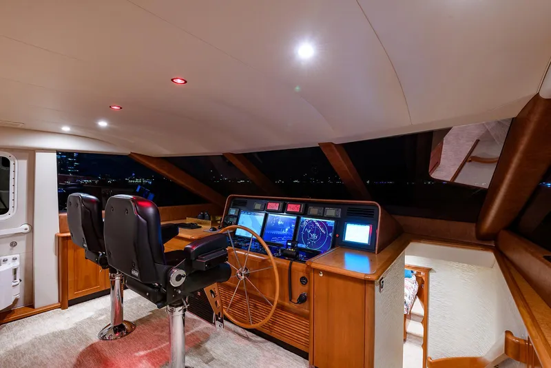 Slide: The Image of Luxurious helm of 2009 Pacific Mariner 85 yacht with modern navigation equipment. - 30